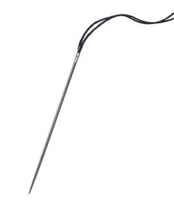 Needle for sewing, black thread, macro closeup, isolated